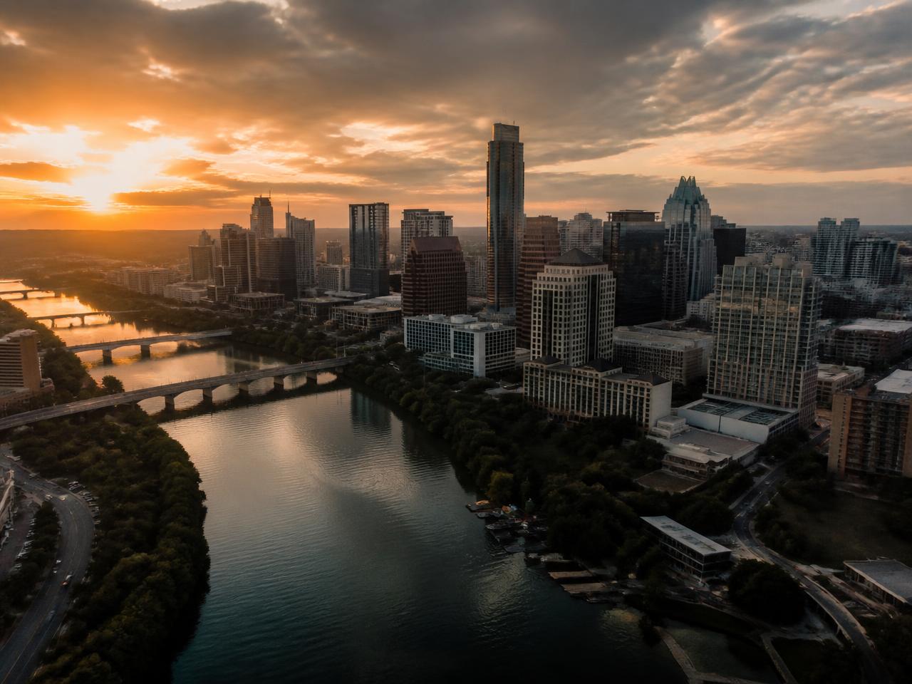 Austin downtown skyline over Lady Bird Lake at sunset