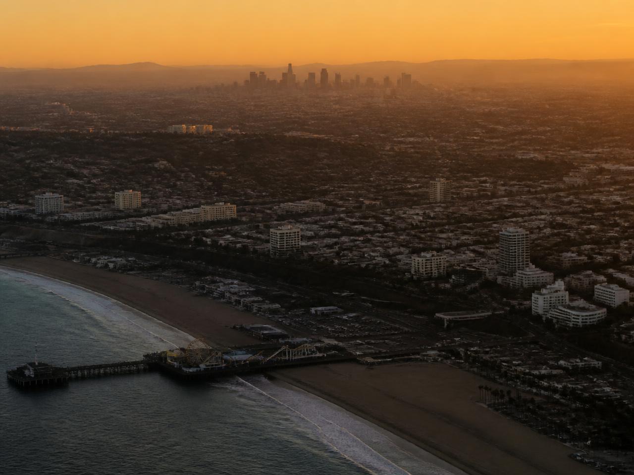 Los Angeles coastline with downtown skyline at golden dusk